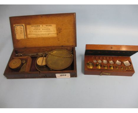 Oak cased set of late 19th / early 20th Century steel and brass sovereign scales with William A. Webb, small quantity of W & 