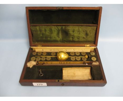 Mahogany cased brass hydrometer with weights, ivory backed thermometer and two ivory sliding rules, the cover inscribed T. Gi