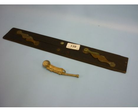 19th Century ebony and brass mounted maritime parallel rule with a silver plated Bosun's whistle, bearing arrow mark