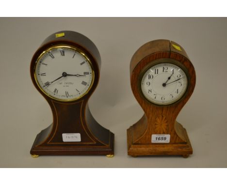 Edwardian oak cased balloon shaped mantel clock (a/f) together with a similar reproduction mahogany clock