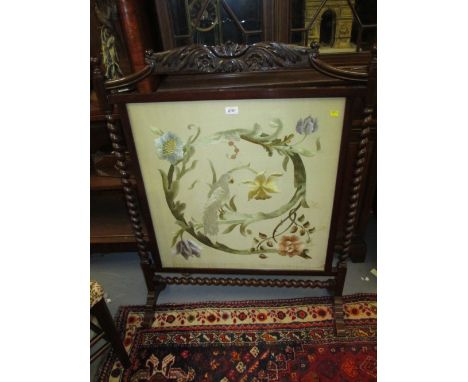 Early 20th Century mahogany firescreen inset with a silk panel