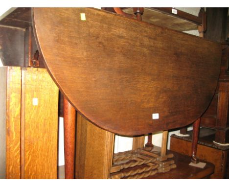 18th Century oak oval drop-leaf dining table on tapering supports with pad feet, together with a set of four late 19th or ear