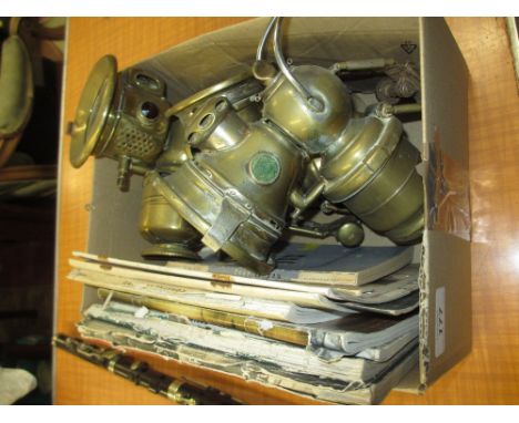 Two Lucas brass lamps, another similar lamp and a small quantity of World War II ephemera