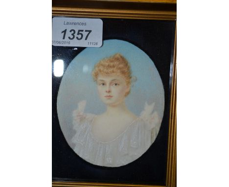 19th Century oval mounted gilt framed miniature portrait of a young lady in white lace tunic