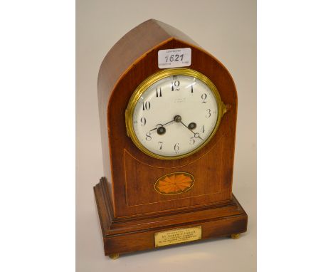 Edwardian mahogany line and lunette inlaid lancet shaped mantel clock, the enamel dial with Arabic numerals, the two train mo