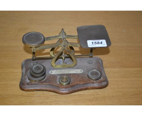 Pair of early 20th Century brass letter scales with weights