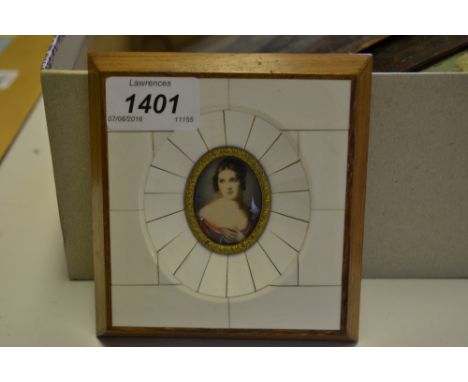 Miniature oval head and shoulder portrait of a young lady in decorative frame