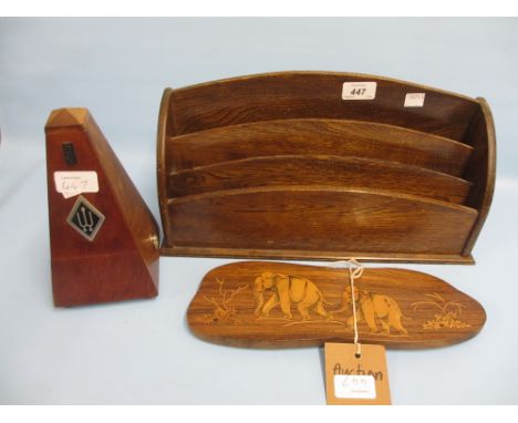 Oak stationery rack, modern mahogany cased metronome and an Indian inlaid plaque decorated with elephants
