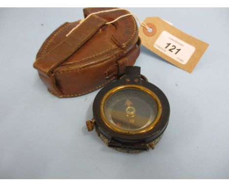 Brass and black Japanned hand bearing compass in original leather pouch by Cary