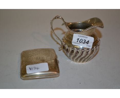 Small silver cream jug of half fluted design and a silver cigarette case