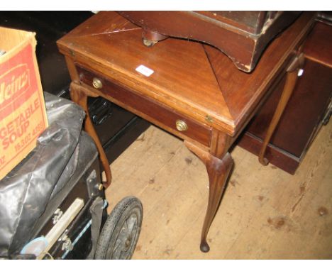 Edwardian mahogany envelope card table having swivel top above a single drawer on cabriole supports