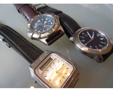Swiss army stainless steel cased wristwatch together with a Rotary Swiss Commando wristwatch and a Citizen quartz wristwatch
