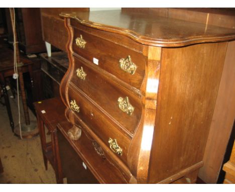 Small continental oak bombe commode chest of three drawers, raised on claw and ball supports