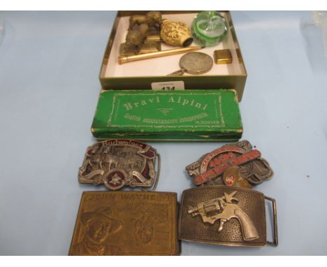 Four various belt buckles, a Hohner harmonica and a quantity of other miscellaneous items