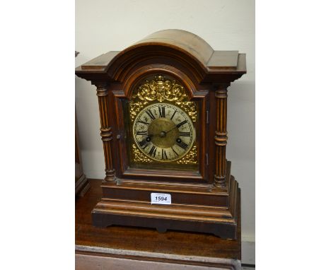 19th Century Continental walnut bracket clock, the gilded and silvered dial with Roman numerals, the two train movement strik