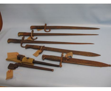 Group of five various early 20th Century bayonets, one with scabbard and two spike bayonets with scabbards