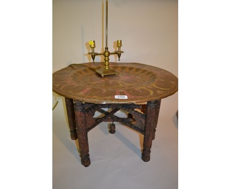 Circular Benares tray top coffee on folding carved hardwood stand, together with a brass two branch table lamp base