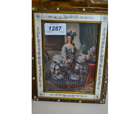 Continental oil on ivorine, full length portrait of an 18th Century lady, indistinctly signed, in a decorative gilt brass and