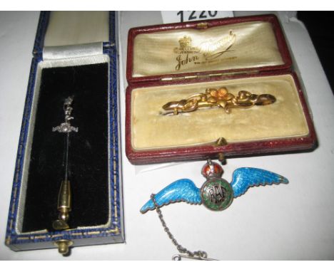 Gold bar brooch in a red leather covered box, an enamelled silver R.A.F. brooch and a tie pin