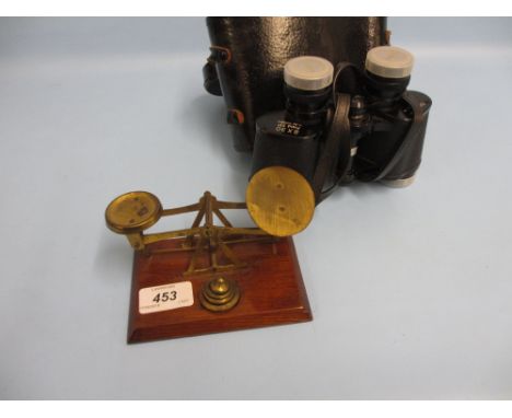 Small pair of brass letter scales with weights and a cased pair of binoculars