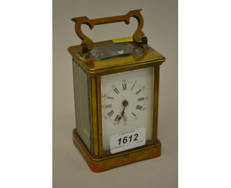 Early 20th Century gilt brass carriage clock, the enamel dial with Arabic and Roman numerals