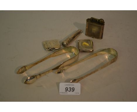 Two silver vesta cases, silver cheroot holder, sterling silver cased cigarette lighter and two pairs of silver sugar tongs