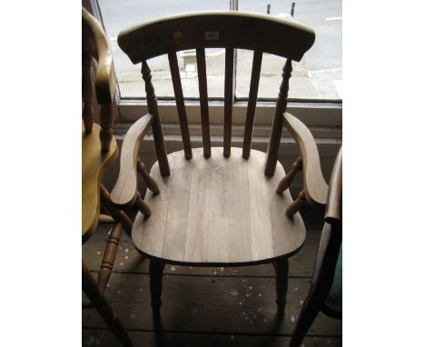 Beechwood stick back kitchen elbow chair raised on turned supports with stretchers