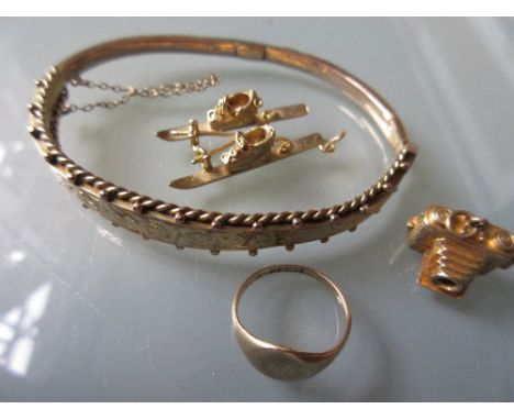 9ct Gold bangle, a signet ring and two 9ct gold charms