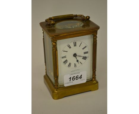 20th Century gilt brass carriage clock having white enamel dial with Roman numerals inscribed E.J. Ayles, Bexhill on Sea