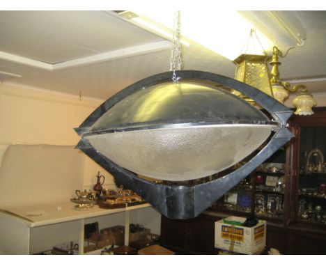 Circular patinated metal flying saucer type street lamp