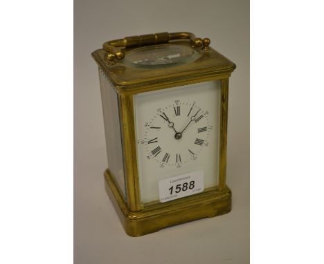 Early 20th Century brass cased carriage clock, the enamel dial with Arabic and Roman numerals and single train movement