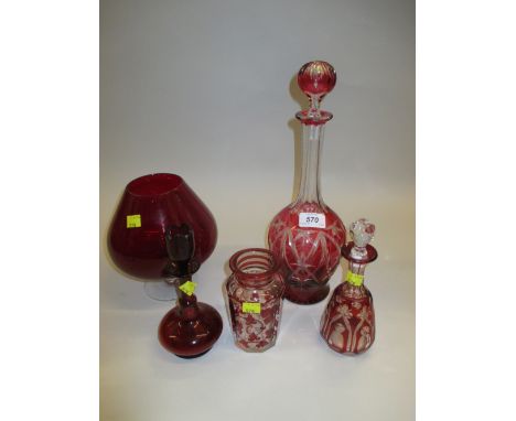 Red overlay cut glass decanter with stopper, similar smaller decanter and three other items