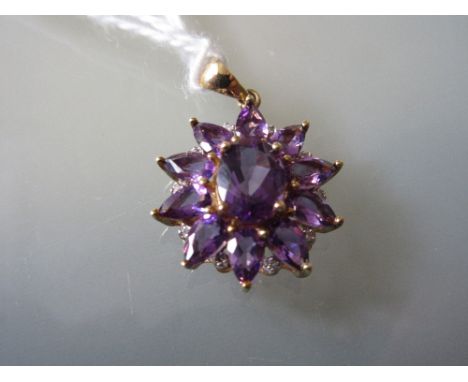 Small 9ct gold amethyst coloured and diamond chip mounted pendant