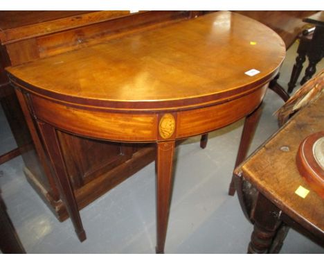George III mahogany rosewood crossbanded and marquetry inlaid demi lune fold-over card table on square tapering supports with