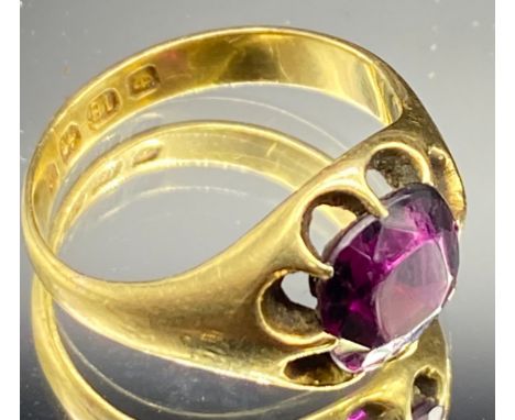 A Rhodolite Garnet claw set 18ct carat gold ring with a cushion cut stone, plain gold shank, ring size L/M 100-150Total weigh