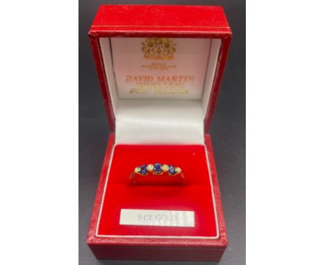 9ct Gold Sapphire and diamond ring With three round cut sapphires and four collet set small diamonds Ring Size P 3.93g