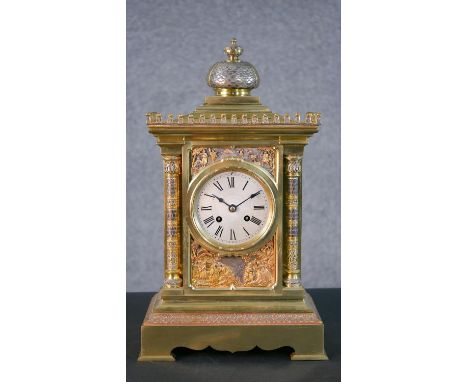 A 19th century tri-metal Egyptian relief design mantle clock of architectural form. Brass movement stamped A star. H.42 W.25 