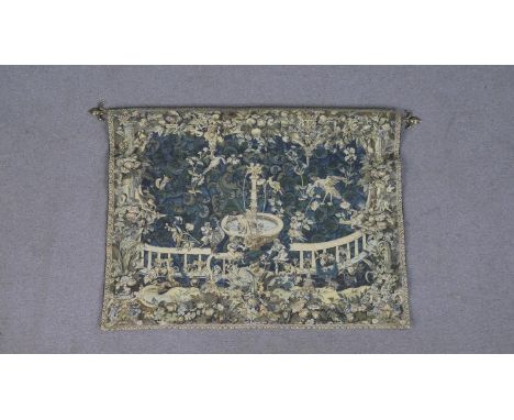 A Belgian Metrax machine made tapestry wall hanging, depicting a garden with birds enjoying a water fountain, on a blue groun