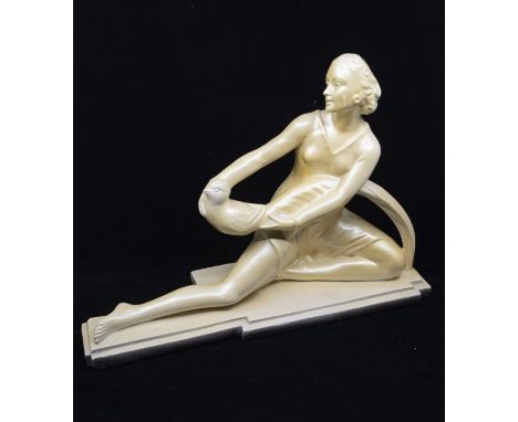 Art Deco - a chalk figure of larger scale modelled as a reclining lady with stylised bird on a plinth, Reg no 833194, model n