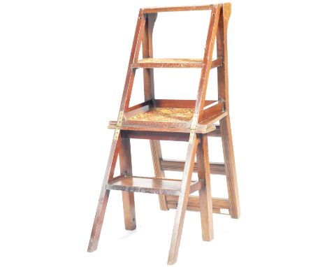 A set of early 20th Century metamorphic folding library steps having a shaped backrest with panel seat. Folds from a single s