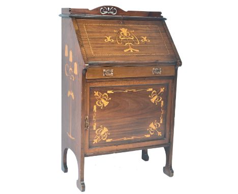 Attributed to Shapland &amp; Petter for Liberty &amp; Co - A late 19th Century Arts &amp; Crafts mahogany and stencil inlaid 