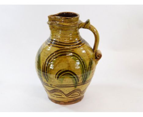 DOUGLAS FITCH. A slipware pitcher by Doug Fitch. Height 40cm.  Please note that all items in this auction are previously owne