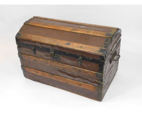 DOMED TRUNK. A late 19th century metal bound, domed wooden trunk with canvas covering & metal handles. With interior tray. H5
