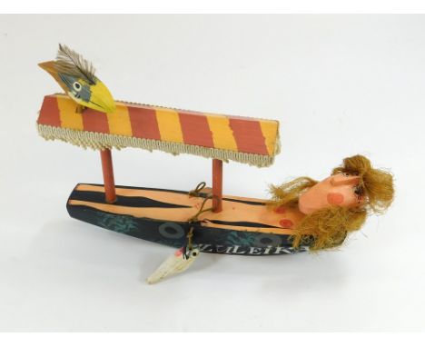 JOHN MALTBY. 'Zuleika'. A John Maltby wooden sculpture, hand carved & painted with added feathers, fringing & string. Signed 