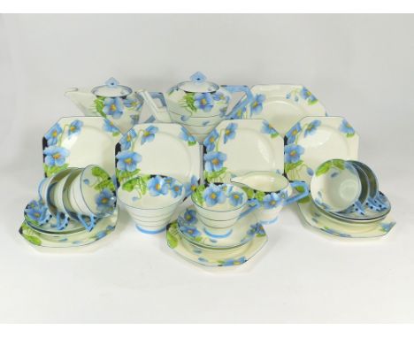 PARAGON. A Paragon fine bone china tea service in the Iceland Poppy pattern. Comprising, teapot, hot water jug, cream jug, su