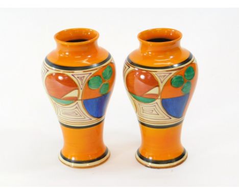 CLARICE CLIFF. A near pair of Clarice Cliff vases in the Melon pattern. Printed Fantasque back stamps. Heights 21.4 & 21.7cm.