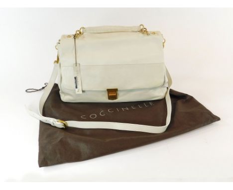 COCCINELLE HANDBAG. A Coccinelle white leather handbag with detachable shoulder strap & ruched handle. The interior with two 