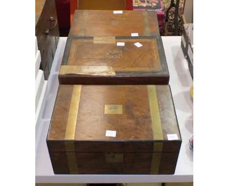 A brass-bound walnut writing slope, two others, (damaged) and a cabin trunk with P &amp; O luggage labels.