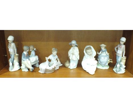 A collection of Nao ceramic figurines, including 'It's Time to Sleep, with Dog in Basket', 'First Love', 'Girl Sitting on Whe