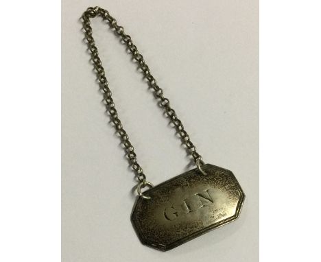A Victorian silver wine label for 'Gin'. London 1848. By WK. Approx. 8 grams. Est. £20 - £30.